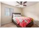 Cozy bedroom with a double bed and Nashville-themed blanket at 3640 W Melinda Ln, Glendale, AZ 85308