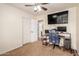 Well-lit bedroom with a gaming setup and built-in desk at 3640 W Melinda Ln, Glendale, AZ 85308