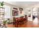 Charming dining area with hardwood floors and a view into the living room at 3640 W Melinda Ln, Glendale, AZ 85308