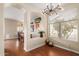 Bright dining room with hardwood floors and an arched entryway at 3640 W Melinda Ln, Glendale, AZ 85308