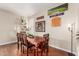 Charming dining room features a wood table with four chairs, and decorative wall art at 3640 W Melinda Ln, Glendale, AZ 85308