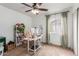 Functional home office with a desk, chair, and ample bookshelves at 3640 W Melinda Ln, Glendale, AZ 85308