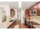 Modern kitchen with wood cabinets and stainless steel appliances at 3640 W Melinda Ln, Glendale, AZ 85308