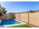 Inviting backyard with refreshing pool, basketball hoop, and mountain views at 3640 W Melinda Ln, Glendale, AZ 85308