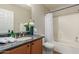 Neat bathroom with granite vanity and shower/tub combo at 3645 E Sheffield Rd, Gilbert, AZ 85296