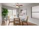 Bright dining room featuring a round table and sliding door access to backyard at 3645 E Sheffield Rd, Gilbert, AZ 85296