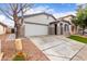 House exterior featuring a two-car garage and well-maintained landscaping at 3645 E Sheffield Rd, Gilbert, AZ 85296