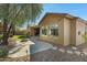 Exterior home view highlighting a well-maintained backyard with artificial turf and a mature tree at 40325 N Graham Way, Anthem, AZ 85086