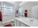 Bright bathroom features a walk-in shower, a dual vanity, and modern fixtures enhancing its appeal at 40325 N Graham Way, Anthem, AZ 85086