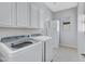 Functional laundry room featuring Samsung washer and dryer and ample cabinet space at 40325 N Graham Way, Anthem, AZ 85086