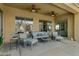 Relaxing covered patio provides ample seating, offering a peaceful outdoor living space at 40325 N Graham Way, Anthem, AZ 85086