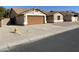 Charming single-story home featuring a two-car garage and a well-maintained concrete driveway at 4130 W Chama Dr, Glendale, AZ 85310