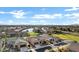 Aerial view of a community with lake and houses at 41929 W Springtime Rd, Maricopa, AZ 85138