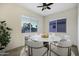 Bright dining area with round table and six chairs at 41929 W Springtime Rd, Maricopa, AZ 85138