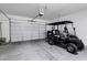 Garage with golf cart and plenty of storage space at 41929 W Springtime Rd, Maricopa, AZ 85138