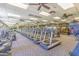 Well-equipped gym featuring rows of modern treadmills, promoting a healthy and active lifestyle within the community at 41929 W Springtime Rd, Maricopa, AZ 85138