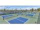 A full view of the community's multiple well-maintained pickleball courts at 41929 W Springtime Rd, Maricopa, AZ 85138