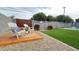 Outdoor seating area on a stamped concrete patio with a well-maintained lawn, rock ground cover, and decorative landscape at 4201 N 18Th Pl, Phoenix, AZ 85016