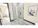 Bathroom showcasing a glass-enclosed shower with sleek fixtures and stylish decorative wall art at 4201 N 18Th Pl, Phoenix, AZ 85016