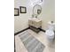 Charming bathroom features a stylish vanity, round mirror, and modern fixtures at 4201 N 18Th Pl, Phoenix, AZ 85016