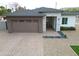 A well-maintained one-story home boasting a two-car garage, brick driveway, and minimalist landscaping at 4201 N 18Th Pl, Phoenix, AZ 85016