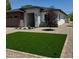 Charming single-story home featuring a modern design and well-manicured landscaping with artificial grass at 4201 N 18Th Pl, Phoenix, AZ 85016