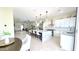 Open concept kitchen flows into the living and dining areas, featuring a large island with barstool seating at 4201 N 18Th Pl, Phoenix, AZ 85016