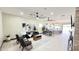 Open-concept living area flowing into the kitchen, featuring contemporary decor, ceiling fans, and ample natural light at 4201 N 18Th Pl, Phoenix, AZ 85016