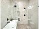 Modern shower with a full glass enclosure, rain shower head, and pebble tile floor at 4201 N 18Th Pl, Phoenix, AZ 85016