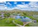 Aerial view of Anthem community park with lake and mountains at 42424 N Gavilan Peak Pkwy # 47102, Anthem, AZ 85086