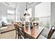 Dining area with wood table, chairs, and stylish lighting at 42424 N Gavilan Peak Pkwy # 47102, Anthem, AZ 85086