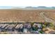 Aerial view of a two-story house with desert landscape at 44020 N 50Th Ln, New River, AZ 85087