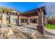 Expansive backyard patio with pergola and pool access at 44020 N 50Th Ln, New River, AZ 85087