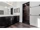 Modern bathroom with walk-in shower and double vanity at 44020 N 50Th Ln, New River, AZ 85087