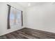 Bright bedroom with large window and gray curtains at 44020 N 50Th Ln, New River, AZ 85087