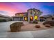 Two-story house with stucco exterior, three-car garage, and landscaped front yard at 44020 N 50Th Ln, New River, AZ 85087