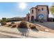 Two-story house with stucco exterior, three-car garage, and landscaped front yard at 44020 N 50Th Ln, New River, AZ 85087