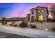 Two-story house with stucco exterior, three-car garage, and landscaped front yard at 44020 N 50Th Ln, New River, AZ 85087