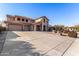 Two-story house with a three car garage and a large driveway at 44020 N 50Th Ln, New River, AZ 85087