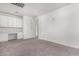 Home office with white cabinets and built-in desk at 44020 N 50Th Ln, New River, AZ 85087