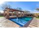 Stunning pool area with pergola, fountain and spacious patio at 44020 N 50Th Ln, New River, AZ 85087