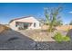 Landscaped backyard with a patio and gravel at 4526 E Danta St, San Tan Valley, AZ 85143