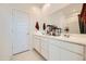 Double vanity bathroom with white cabinets and a large mirror at 4526 E Danta St, San Tan Valley, AZ 85143