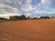 Daytime view of the Desert Breeze Park's baseball field under a cloudy blue sky at 4760 W Tulsa St, Chandler, AZ 85226