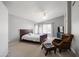 Serene bedroom with vaulted ceiling, ceiling fan, large window and comfortable seating area at 4760 W Tulsa St, Chandler, AZ 85226