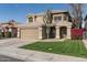 Charming home featuring a well-manicured front lawn, mature landscaping, and a two-car garage at 4760 W Tulsa St, Chandler, AZ 85226