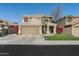 Two-story home with a tile roof, neutral stucco, and a well-manicured front lawn at 4760 W Tulsa St, Chandler, AZ 85226