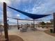 Relaxing picnic area at Desert Breeze Park, offering shade and scenic lakeside views at 4760 W Tulsa St, Chandler, AZ 85226