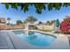 Backyard pool with a diving board, shed, lounge chairs and grass at 4760 W Tulsa St, Chandler, AZ 85226