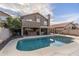 Backyard pool with a diving board, with a covered patio and hot tub at 4760 W Tulsa St, Chandler, AZ 85226